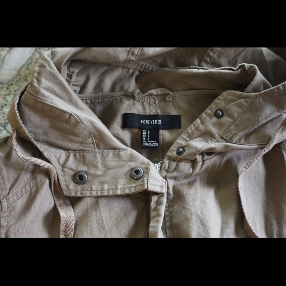 Tan/brown trench-style, zip-up coat. Never worn